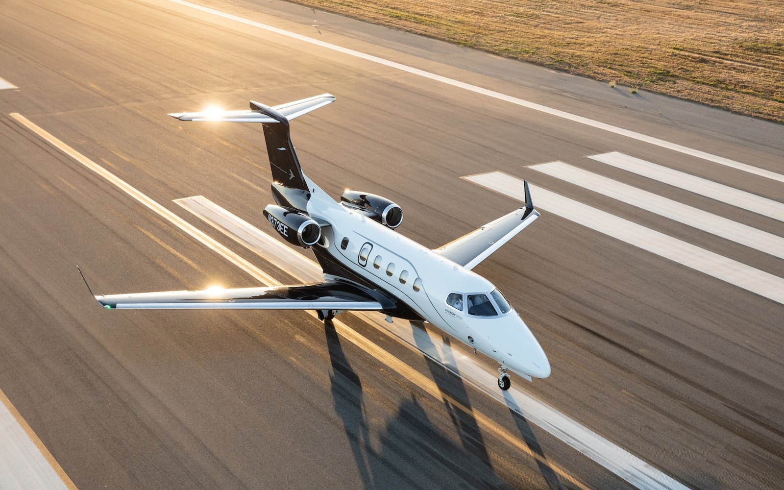 The Embraer Phenom 300EV on the runway, official manufacturer press photograph
