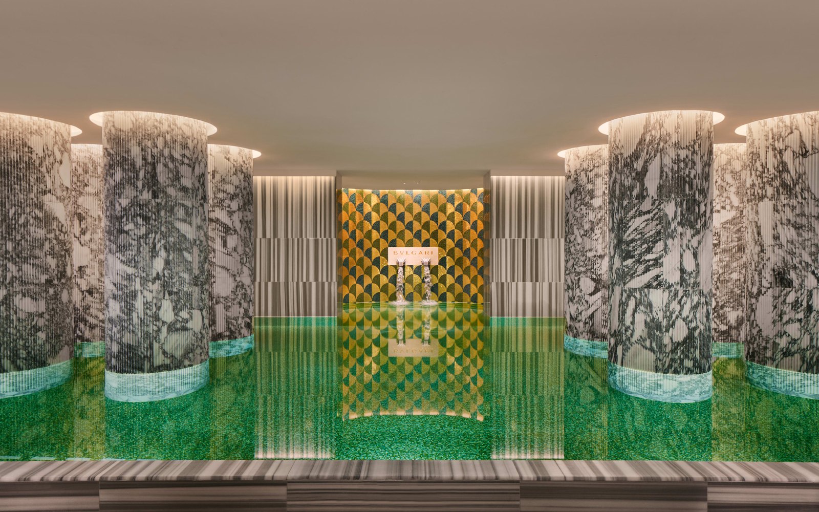 The spa pool at Bulgari Hotel Roma, with marble columns and patterned mosaic tile