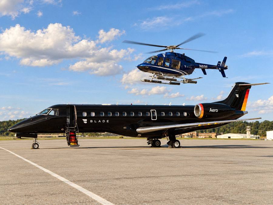 An Aero aircraft in Blade livery with a Blade helicopter above