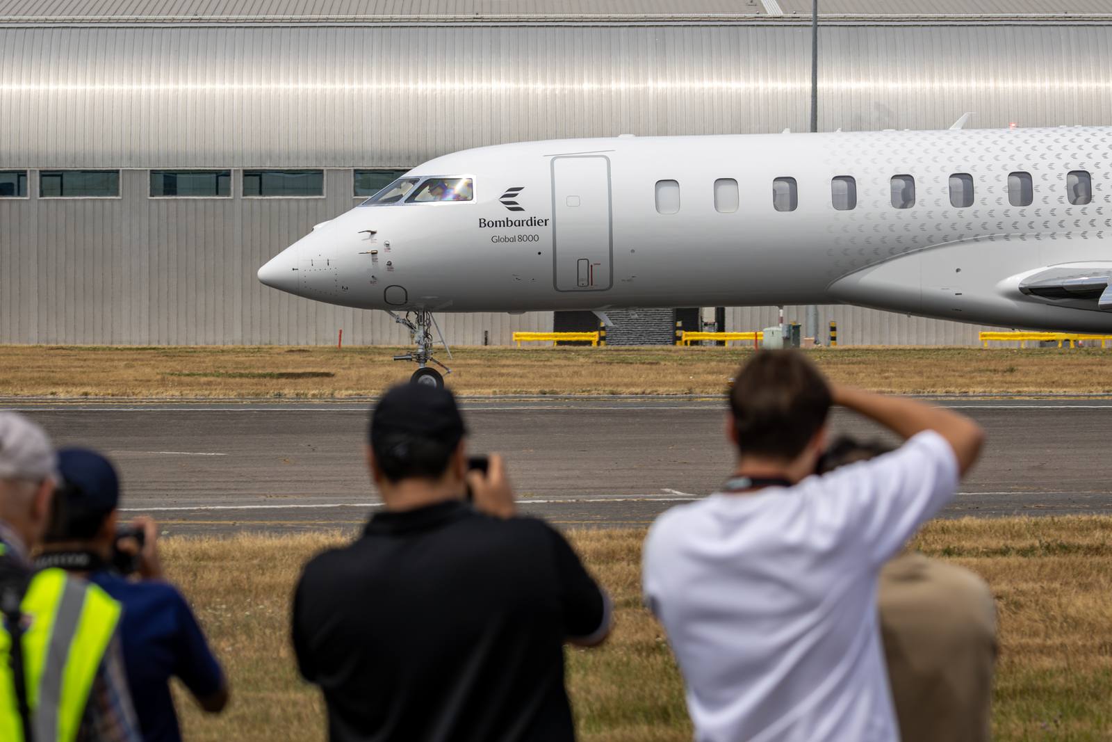 Global 8000 N100BD on the ground at Fairford with spectators photographing it