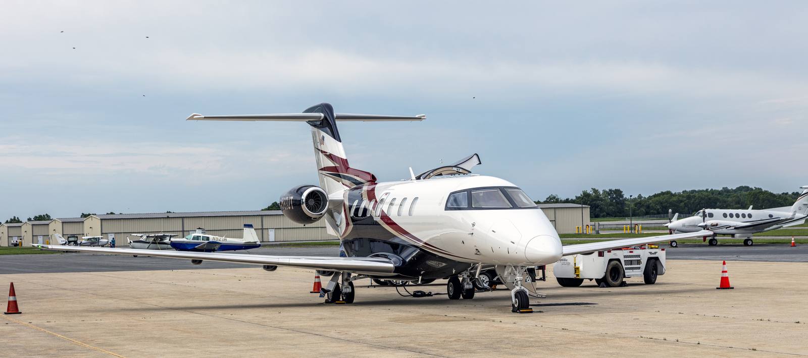 Pilatus PC-24 registration N587JT parked on an airport ramp
