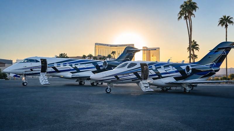 Thrive Aviation’s HondaJet HA-420 and Bombardier Challenger 3500 in the fleet’s custom livery at sunset in Las Vegas