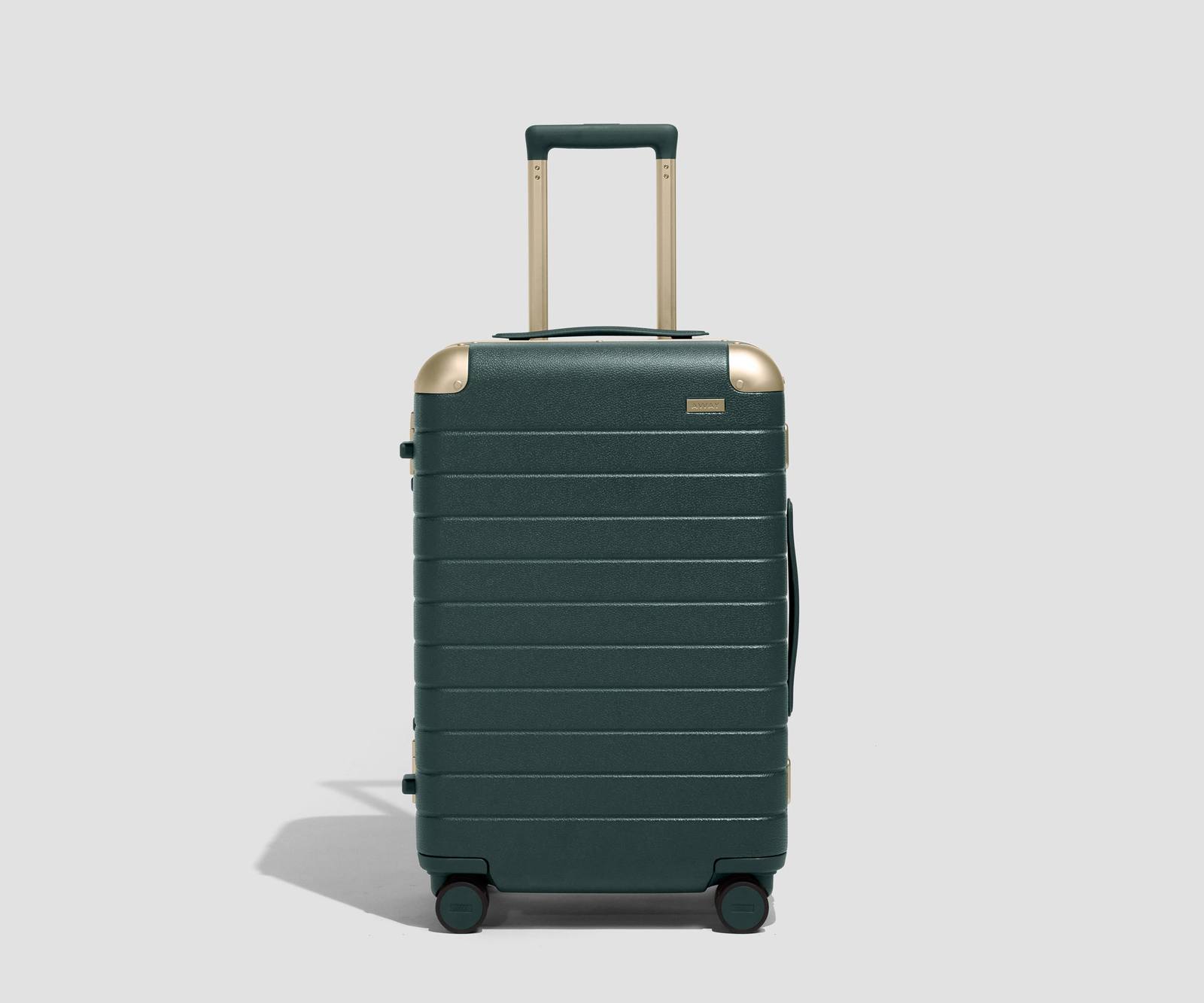 Away Aluminum Edge Bigger Carry-On in No. 20 Pine with champagne hardware