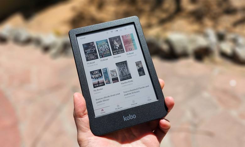 Kobo Clara Colour e-reader with colour book covers on screen, held in one hand